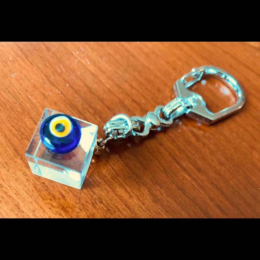 Nice metal key chain with a crystal glass cube and cobalt blue glass evil eye